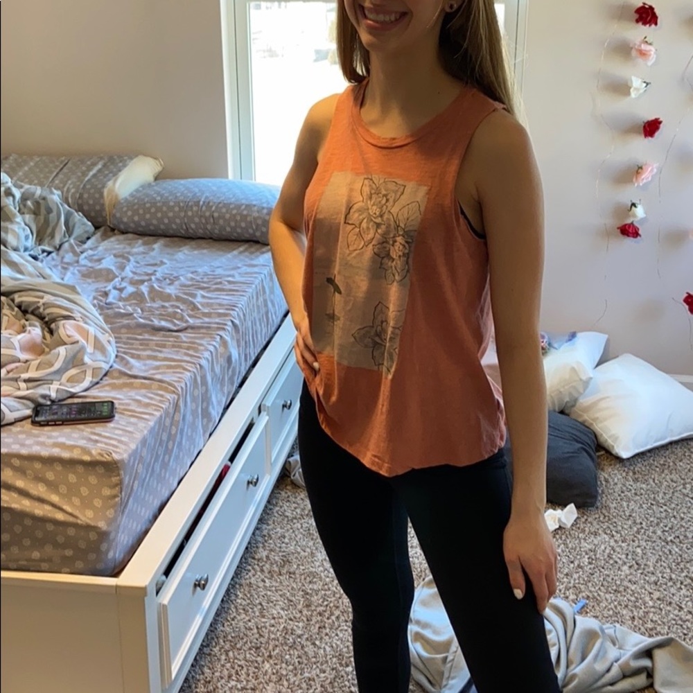 A summer shirt, that is lightly warn.